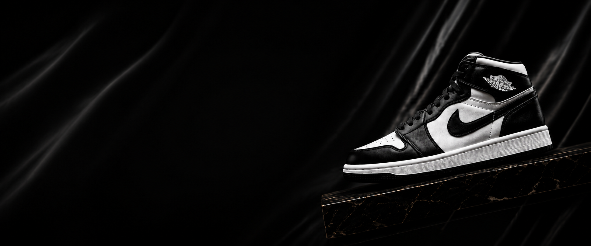 Black and white Air Jordan 1 in 10/10 imported condition on a marble slab